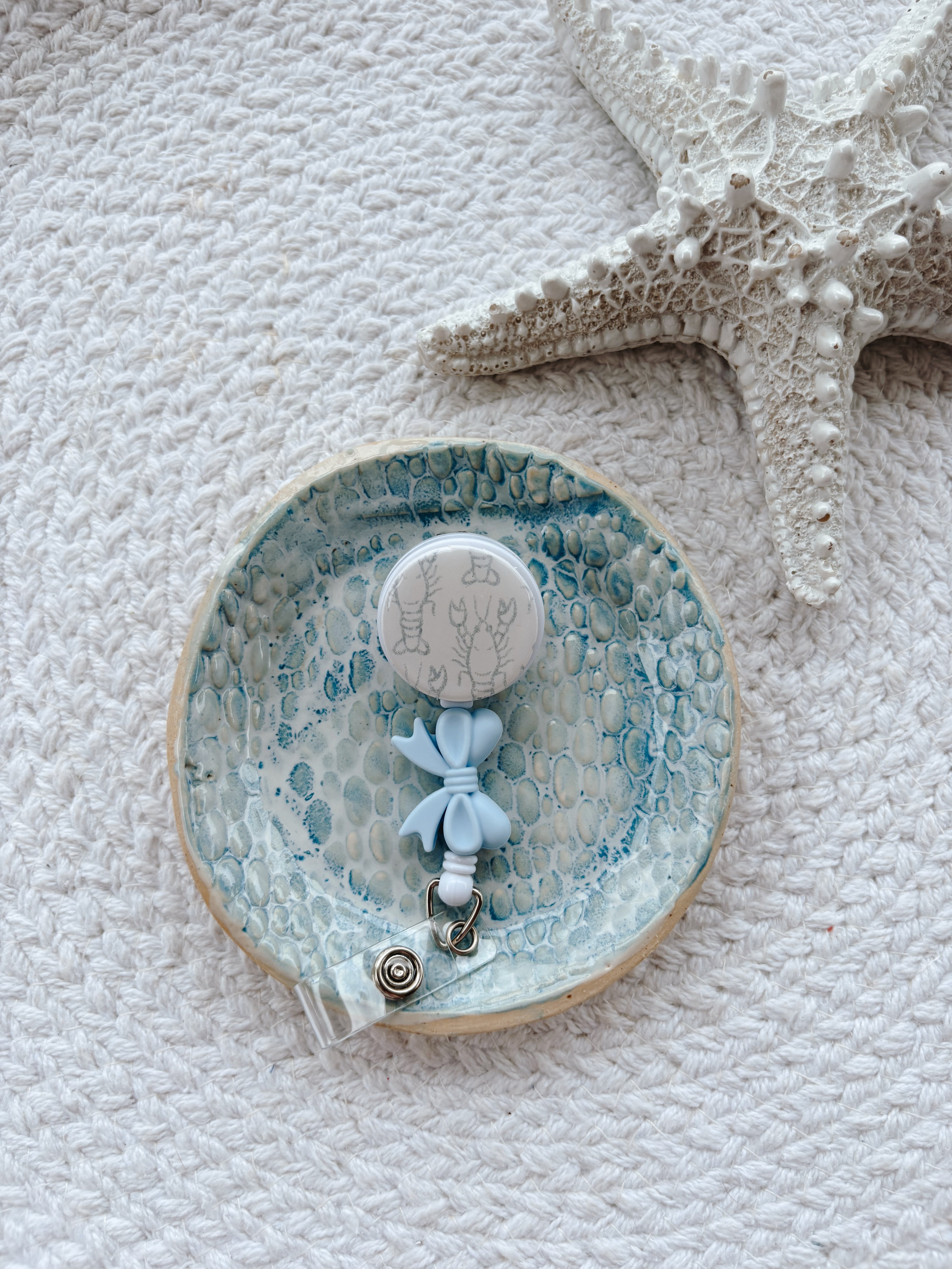 Lobster Bow Badge Reel